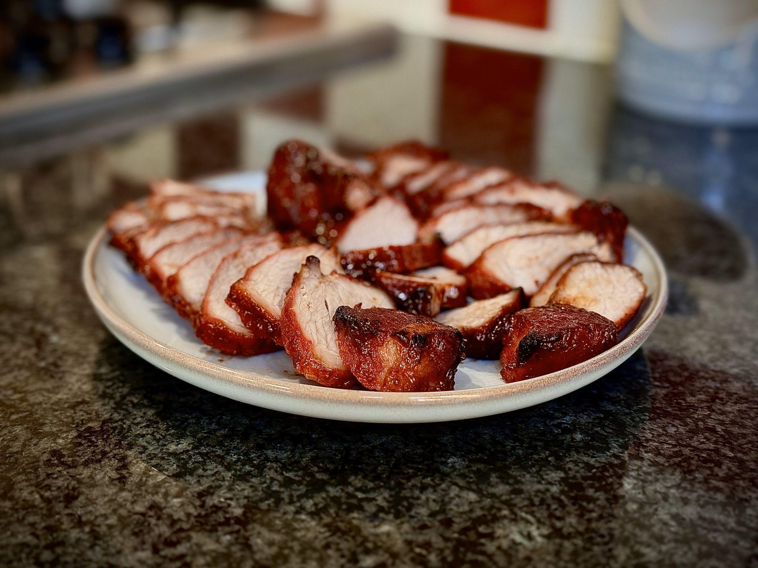 Char Siu prok sliced and on a plate.